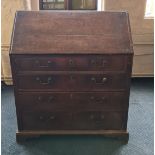 A 19th century oak bureau with four drawers.