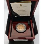 A boxed gold proof Sovereign coin 2021 with certificate 0575.