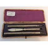 A hallmarked L&CO silver pen, propelling pencil, letter opener set (in box)