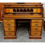 A 19th century mahogany cylinder top desk with fitted interior.