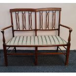 A Edwardian mahogany two seater chair.