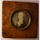 A 19th century portrait miniature on ivory of a Georgian gentleman the circular oval in square