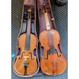 A full size violin together with a 3/4 violin.