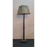 A oak barley twist standard lamp and shade.