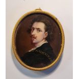A 18th/19th century portrait miniature on ivory of a 17th century man in gilt metal oval frame. This