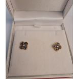 A pair of sapphire and diamond quatre foil stud earrings