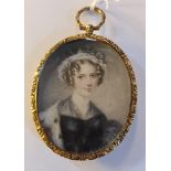 A 19th century portrait miniature on ivory of a lady with ermine fur top in gilt metal frame and