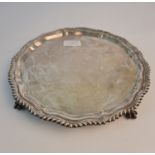 A hallmarked silver card tray on claw feet, approx. width 26cms