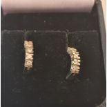 A pair of screw on diamond hoop earrings