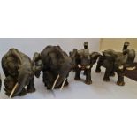 Four large elephant figures.