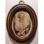 A 19th century portrait miniature on ivory of a lady holding a flower in oval wood frame. This