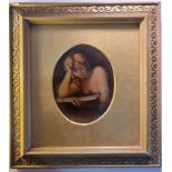 A late 19th century/early 20th century crystoleum portrait of lady reading a book in gilt oval mount