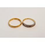 A rubbed marked wedding band, ring size O, and a rubbed 18ct mark half eternity diamond ring, (one