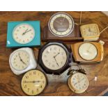 Eight assorted clocks to include bakelite and retro style.