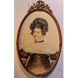 A watercolour portrait miniature of a Mrs Margaret Bushley (see verso) of a lady with black hair