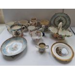 A collection of mixed pottery to include a loving cup plates jugs etc.