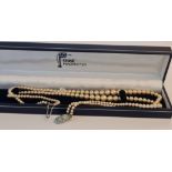 A double row string of pearls with diamante clasp (stones missing,) in box 'Rennie Mackintosh'