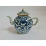 A 19th century Chinese blue and white teapot flower and leaf with spiral to rim design height 12