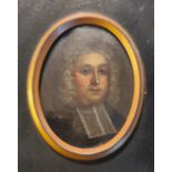 A portrait miniature of a clergyman on copper oval in wood frame.