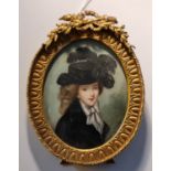 A 19th century portrait miniature on ivory of lady in black hat with feathers and a black dress