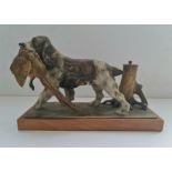 A cold painted spelter desktop match striker in the form of a hunting dog and pheasant height 16,5
