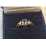 An 18ct hallmarked yellow gold sapphire and diamond three stone ring, approx. total diamond carat