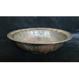 A 18th century Turkish copper and pewter bowl with Arabic writing to rim 26.5 cm.