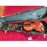 A Stentor 1/4 Violin with case.