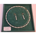 A stamped 9k pearl style necklace with a pair of matching dropper earrings (in box)