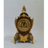 A French boulle front mantle clock with ormolu mounts height approx 30 cm.