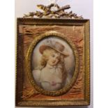 A 19th century portrait miniature on ivory of a French lady in a hat with white dress adorned with a