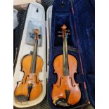 A Rosetti violin 1/2 together with a unnamed violin 3/4 in cases.