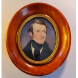 A 19th century portrait miniature on ivory of gentleman in modern wood frame. This item has been