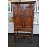 A late 18th century oak two door cupboard on a four square legged base height approx 170 cm.