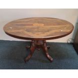 A 19th century walnut loo table with inlay to top.