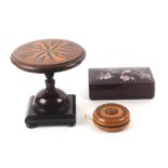 An apprentice style miniature table, a yo yo and an oriental box, the circular table top inlaid with
