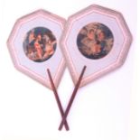 A pair of Georgian cardboard face screens, of heptagon form each with central circular colour