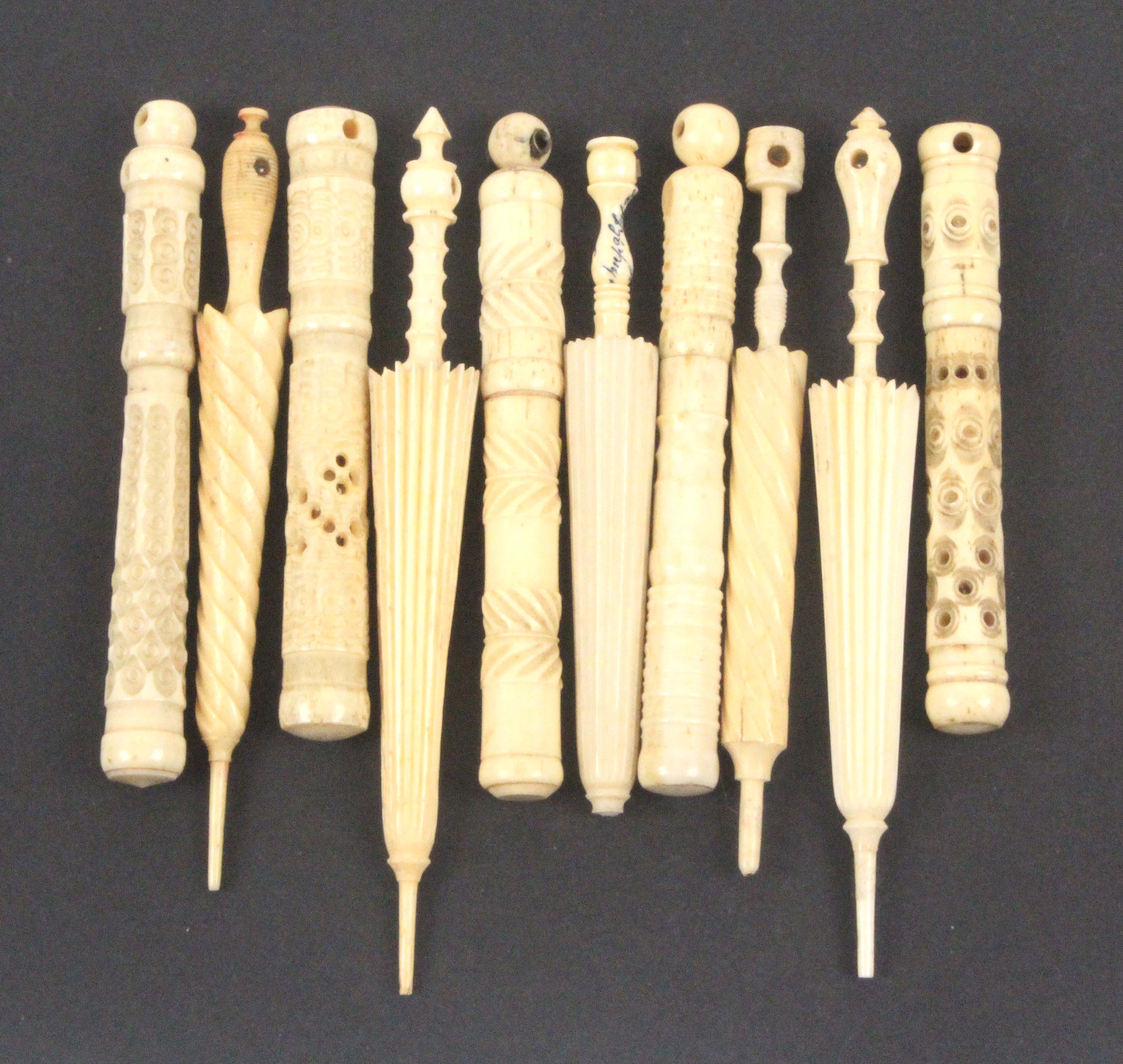 Stanhopes - ten - sewing, comprising five bone cylinder needle cases and five furled umbrella