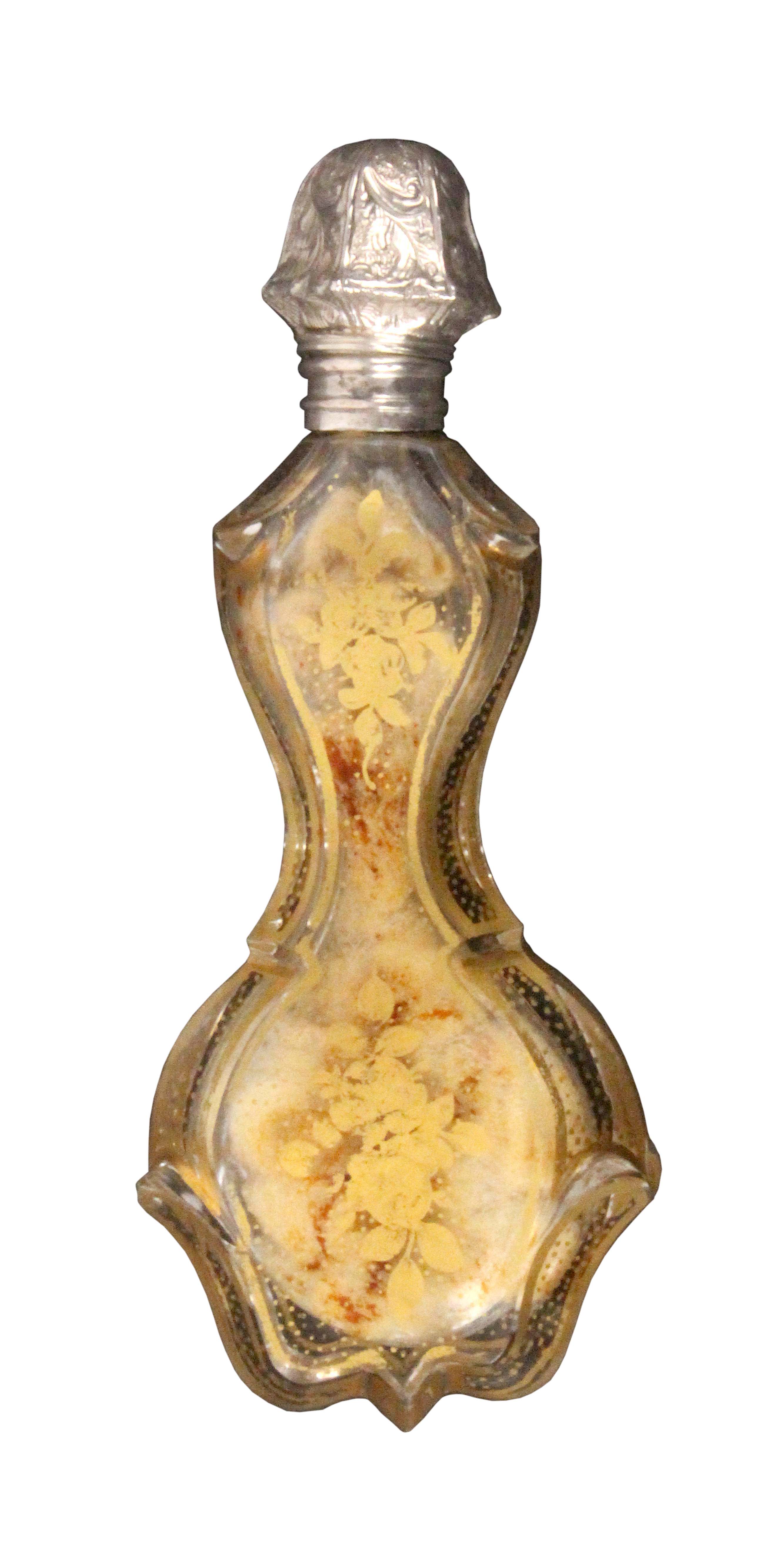 A mid 19th Century French perfume bottle, the glass body of shaped and stepped form decorated with