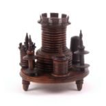 A good rosewood turret form sewing companion, circa 1830, the turned circular base raised on three