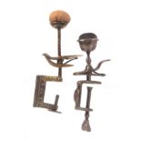 Two metal sewing clamps, comprising a brass hemming bird example with leaf decorated frame, the