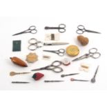 A mixed lot - sewing, comprising seven pairs of scissors, one pair with silver arms and loops,