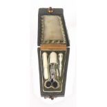 A rare French miniature etui for a doll, the leather and gilt tooled case of tapering form with