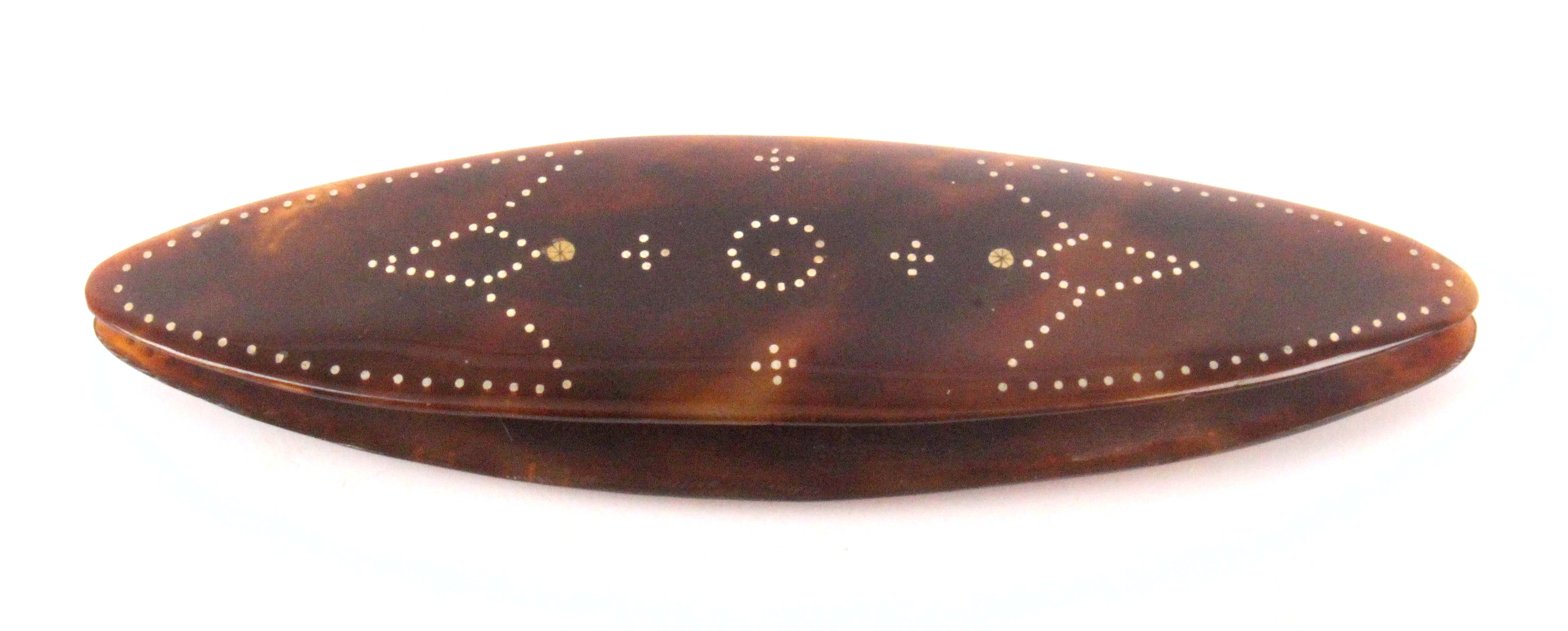A large late 18th Century tortoiseshell shuttle, each side with two gilt flower head rivets and