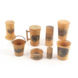 Mauchline ware - eight pieces, comprising a tumbler case (A Welsh Market Scene), 7.5cms, a dice