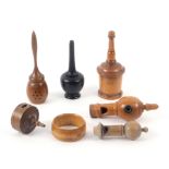 Treen - seven pieces, comprising a boxwood glove powderer, 13cms, another in ebony, lacking screw