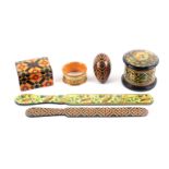 Mauchline ware - six pieces, alternative finishes, a dome top cylinder powder box (oriental lid /