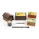 Mauchline ware - seven pieces, alternative finishes, comprising a house shaped box (Gothic / black
