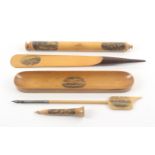 Mauchline ware - five pieces, desk accessories, comprising a cylinder ruler with pencil and