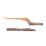 Two early 19th Century fruitwood knitting sticks, comprising a well patinated goose wing example